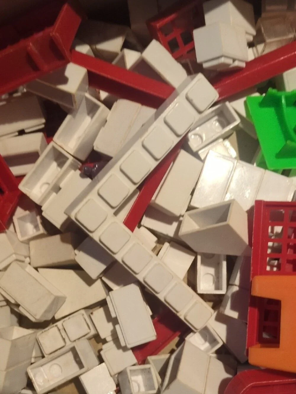 Assorted Kids Building Set Pieces in Red, White, Green, Orange